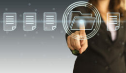 Finger touching loading file button on a touch screen