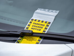 parking ticket on wind screen of vehicle
