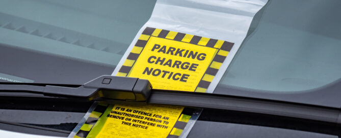 parking ticket on wind screen of vehicle